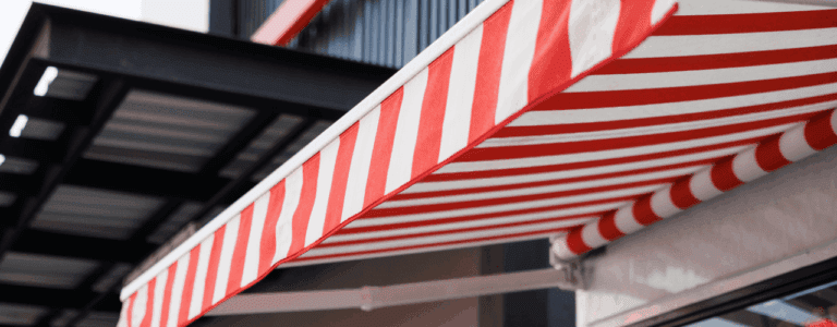 Commercial awning covering outdoor dining area in London café