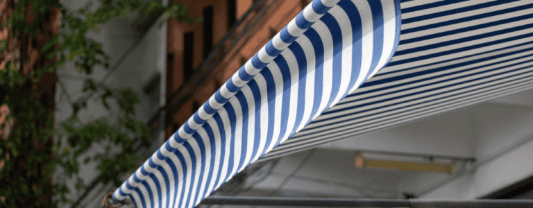 Commercial building with awning and canopy covering outdoor space