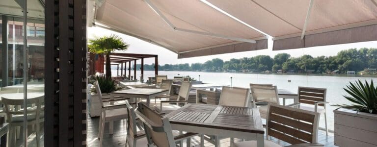 Commercial outdoor dining with protective awning